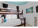 Comfortable bedroom with bunk beds, perfect for or guests, with a beachy aesthetic at 224 17Th St # 224, Bradenton Beach, FL 34217