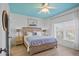 Serene main bedroom with a king-sized bed, wood floors, and a bright window at 224 17Th St # 224, Bradenton Beach, FL 34217