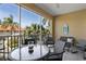 Relaxing screened patio with comfortable seating to enjoy the beautiful Florida weather at 224 17Th St # 224, Bradenton Beach, FL 34217