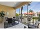 Enclosed patio with tile flooring, a ceiling fan, and seating around a table with views of the neighborhood at 224 17Th St # 224, Bradenton Beach, FL 34217