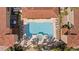 Aerial view of the large community pool with a hot tub, lounge chairs, and lush landscaping around the pool area at 224 17Th St # 224, Bradenton Beach, FL 34217