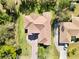 A bird's-eye view highlights the detailed roof design and complementary landscaping of the home at 23117 Hammond Ave, Port Charlotte, FL 33954