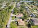 An aerial view displays the neighborhood setting, showcasing the home's location within a residential community at 23117 Hammond Ave, Port Charlotte, FL 33954