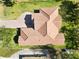 An aerial view reveals an intricately designed roof and a perfectly manicured lawn that elevates the property's appeal at 23117 Hammond Ave, Port Charlotte, FL 33954