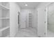 Spacious walk-in closet with built-in shelving, marble floors and natural lighting at 23117 Hammond Ave, Port Charlotte, FL 33954