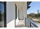 A modern balcony with black railings and views of the neighborhood at 2345 Oak Ter, Sarasota, FL 34231