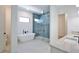 Modern bathroom featuring a soaking tub, glass shower, and double vanity at 2345 Oak Ter, Sarasota, FL 34231