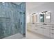 Modern bathroom featuring a glass shower and double vanity with modern fixtures at 2345 Oak Ter, Sarasota, FL 34231