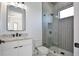 Modern bathroom featuring single sink, stylish lighting fixtures, and a walk-in shower at 2345 Oak Ter, Sarasota, FL 34231