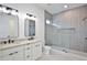 Modern bathroom featuring a double vanity and stand up shower with unique tiling at 2345 Oak Ter, Sarasota, FL 34231