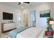 Stylishly decorated bedroom featuring bed, dresser and view to hallway at 2345 Oak Ter, Sarasota, FL 34231