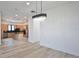 Modern living room with a chandelier and a clear view of the kitchen at 2345 Oak Ter, Sarasota, FL 34231