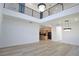 Open-concept living room with a view of the kitchen and a modern chandelier at 2345 Oak Ter, Sarasota, FL 34231