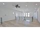 Spacious loft area with hardwood floors, black railings, and abundant natural light at 2345 Oak Ter, Sarasota, FL 34231