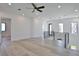 Bright loft featuring hardwood floors, recessed lighting, and stylish black railings at 2345 Oak Ter, Sarasota, FL 34231