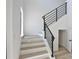 Bright stairs with wood treads, modern railings, a window, and a door to the lower level at 2345 Oak Ter, Sarasota, FL 34231