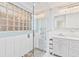 Modern bathroom featuring glass enclosed shower with pebble floor at 2375 Riverwood Pines Dr, Sarasota, FL 34231