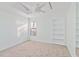 Bedroom with lots of light, carpet flooring, and built-in shelves at 2375 Riverwood Pines Dr, Sarasota, FL 34231