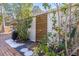 Enclosed outdoor shower surrounded by lush greenery at 2375 Riverwood Pines Dr, Sarasota, FL 34231