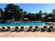 Community pool with sun loungers for relaxing and enjoying sunny days at 2755 Coconut Bay Ln 1K # 119, Sarasota, FL 34237