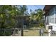 Backyard featuring partial view of the home, greenery, and chain-link fence at 2784 Martin St, Sarasota, FL 34237