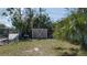 Exterior shot of yard with shed in background and plants in foreground at 2784 Martin St, Sarasota, FL 34237