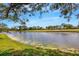 Scenic backyard view of the lake and golf course, offering a peaceful setting at 2961 Taywood Mdws # 26, Sarasota, FL 34235