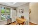 Bright dining area with a drop leaf table, and natural light from window with shutters at 2961 Taywood Mdws # 26, Sarasota, FL 34235