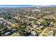 Neighborhood aerial view showcasing the property's location within a mature tree canopy at 3026 Mayflower St, Sarasota, FL 34231