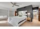 Sleek bedroom showcasing modern design, open closet shelving, and natural light for a stylish retreat at 3026 Mayflower St, Sarasota, FL 34231