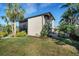 Contemporary home showcasing manicured landscaping, a well-kept lawn, and architectural details at 3026 Mayflower St, Sarasota, FL 34231