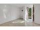 Bright space with sleek flooring, built in storage shelves and a glass door leading outdoors at 3026 Mayflower St, Sarasota, FL 34231