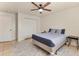 Bedroom featuring a ceiling fan, a large closet, and tile flooring with an area rug at 3311 19Th E St, Bradenton, FL 34208