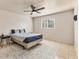 Bedroom featuring a ceiling fan, neutral walls, and tile flooring with an area rug at 3311 19Th E St, Bradenton, FL 34208