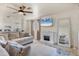 Spacious living room featuring tile floors, a fireplace, and views into the adjacent kitchen at 3311 19Th E St, Bradenton, FL 34208