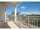 Balcony view of the surrounding neighborhood, with white railings and supporting columns at 3404 79Th Street W Cir # 301, Bradenton, FL 34209