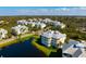 Expansive aerial view of a condo community boasting lush landscaping, serene lakes, and pristine residences at 3404 79Th Street W Cir # 301, Bradenton, FL 34209