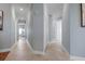 Long hallway with light blue walls and doors to other rooms at 3404 79Th Street W Cir # 301, Bradenton, FL 34209