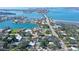 An aerial view capturing the property's proximity to the water, bridge, and vibrant neighborhood surroundings at 3530 Flores Ave, Sarasota, FL 34239