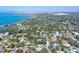 Aerial view showcasing the beautiful city skyline, surrounded by the ocean and lush landscaping at 3530 Flores Ave, Sarasota, FL 34239