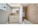 Bathroom featuring a shower and tub combination, a mirror and a white vanity at 3530 Flores Ave, Sarasota, FL 34239