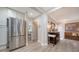 Hallway leads to a stainless steel refrigerator and a view of the bedroom at 3530 Flores Ave, Sarasota, FL 34239