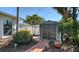 Backyard shed with brick pathway and manicured landscaping at 3530 Flores Ave, Sarasota, FL 34239