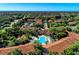 Aerial view showcases the community with lush landscaping and well-maintained buildings at 4061 Crockers Lake Blvd # 2611, Sarasota, FL 34238