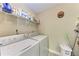 Laundry room complete with a washer and dryer at 4061 Crockers Lake Blvd # 2611, Sarasota, FL 34238