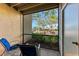 Relaxing screened patio with comfortable seating and a view of the colorful landscaping at 4061 Crockers Lake Blvd # 2611, Sarasota, FL 34238