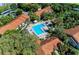 Beautiful aerial view of the community pool and surrounding residential buildings at 4061 Crockers Lake Blvd # 2611, Sarasota, FL 34238