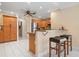 Kitchen featuring breakfast bar with stool seating and stainless steel appliances at 4411 Violet Ave, Sarasota, FL 34233