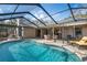 Beautiful backyard pool with a large patio, perfect for entertaining and enjoying the outdoors at 4411 Violet Ave, Sarasota, FL 34233