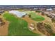 Aerial view of the golf course and lake create a beautiful scenic view for the community at 4543 Terrazza Ct, Lakewood Ranch, FL 34211